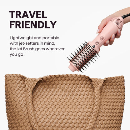 Pink Jet Brush held over a woven brown bag with text about its travel-friendly design.